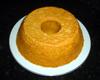 Bolo de cenoura e cobertura de leite condensado cozido com coco