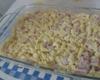 Macarrão ao molho branco com presunto e queijo