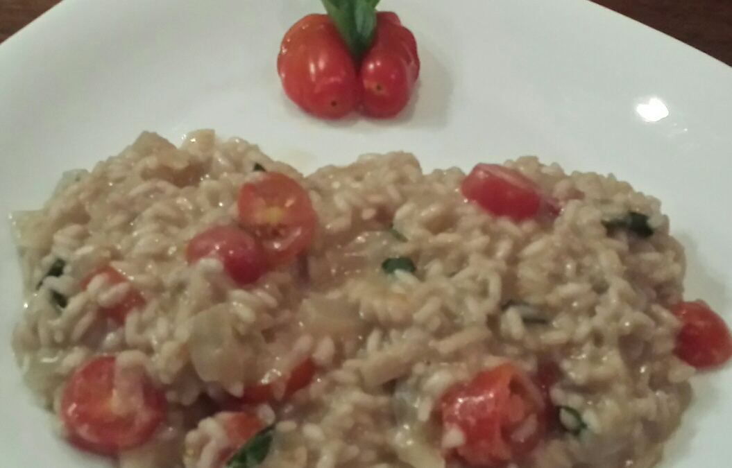 Risoto musarela de bufala, rúcula e tomate cereja