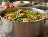 Arroz de costelinha suína cremoso com ervilha muito temperado e saboroso