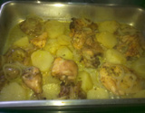 Frango assado com batatas ao molho de laranja