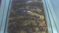 Panqueca com molho de carne moída e recheio de mussarela e presunto