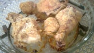 Coxas de frango empanadas e assadas