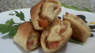 Minipizza enrolada de presunto e queijo