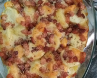 Batata gratinada com creme de queijo e bacon