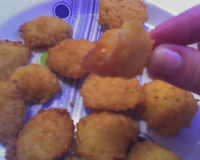 Bolinho de arroz com queijo ralado