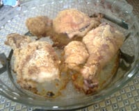 Coxas de frango empanadas e assadas