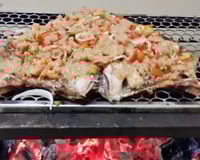 Peixe assado na brasa