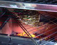 Peixe assado na brasa