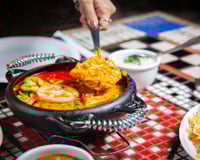 O segredo do TudoGostoso para não talhar o leite de coco na moqueca de peixe