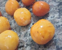 Bala de coco caramelizada (bala baiana ou bala de ovo)