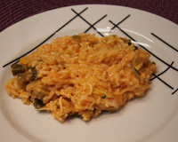 Risoto com tomate seco, mussarela e rúcula da Tam