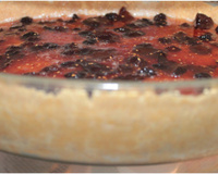 Cheesecake com calda de frutas vermelhas