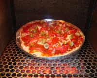 Pizza de forno ou churrasqueira