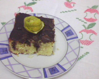 Bolo de laranja com coco e calda de chocolate