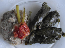 Charuto de couve acompanhado com risoto