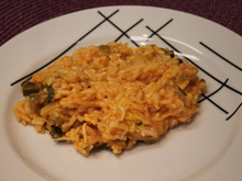 Risoto com tomate seco, mussarela e rúcula da Tam