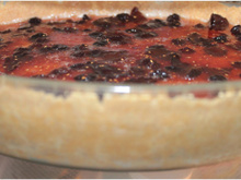 Cheesecake com calda de frutas vermelhas