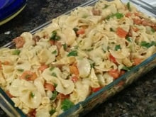 Macarrão com tomate e rúcula