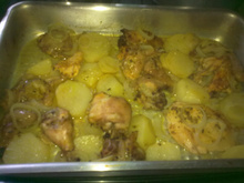 Frango assado com batatas ao molho de laranja