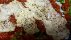 Bife de frango à parmegiana