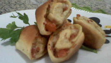 Minipizza enrolada de presunto e queijo